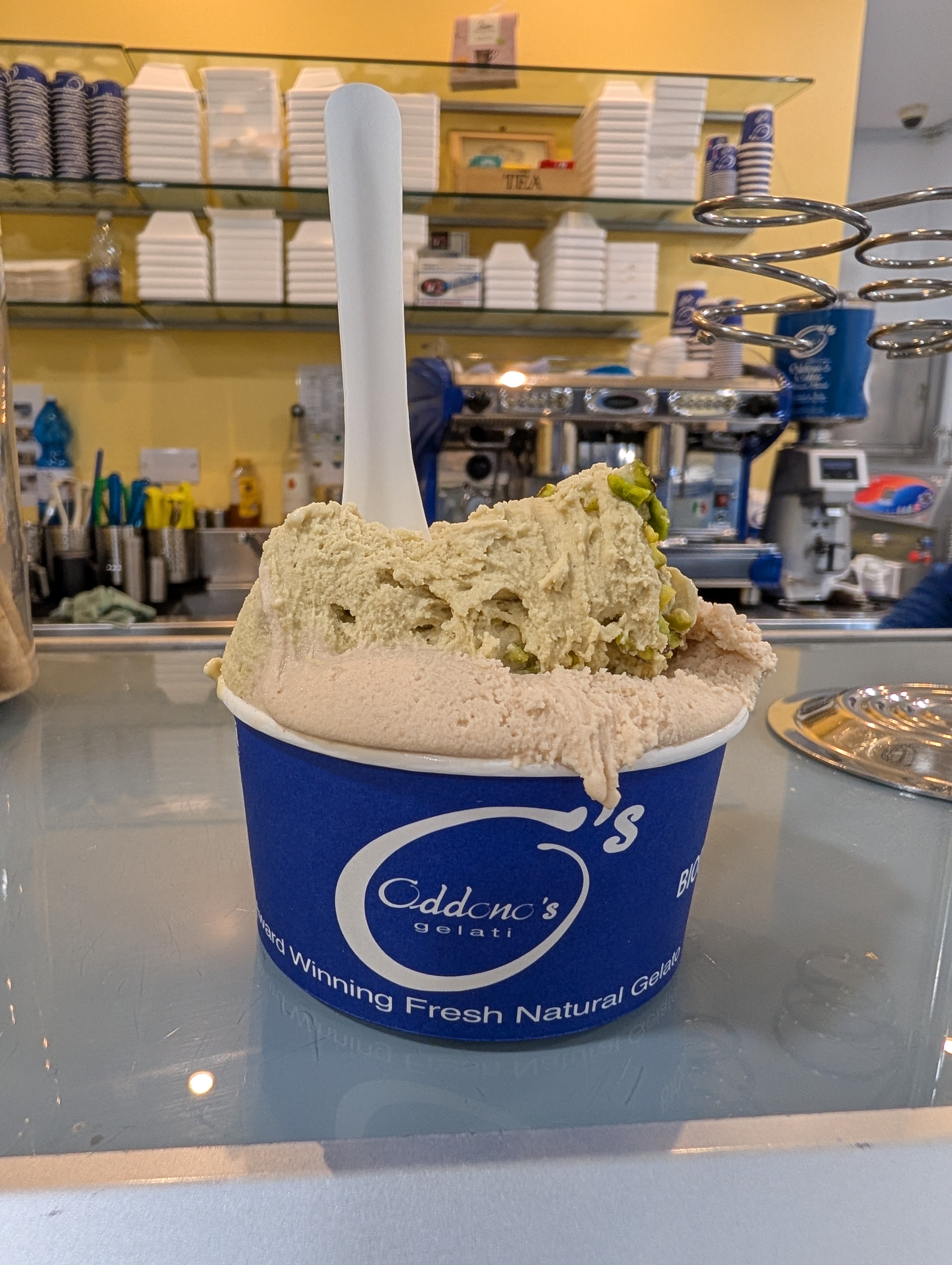 Counter display of fresh Italian gelato at Oddono's London — pistachio, stracciatella, nocciola, dark chocolate